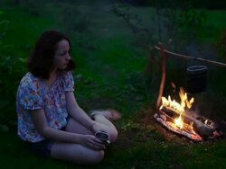 Girl near campfire Stock Footage