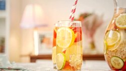 Infused Water with Fresh Strawberries, Lime, Lemon and Basil Stock Footage