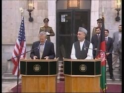 Rumsfeld meets troops, presser with Karzai News Clip