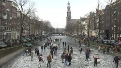 CLEAN : Ice skaters enjoy frozen Amsterdam canals News Clip