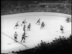 B/W 1961 high angle wide shot Blackhawks scoring against Redwings at Stanley Cup, Detroit / newsreel Stock Footage