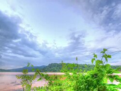 Cloudscape motion passing over at mountain and lake Stock Footage
