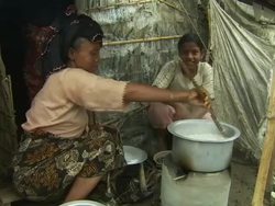 Female refugee cooking rice at Sittwe Rohingya News Clip