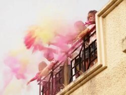 Group of kids playing holi festival on roof top  Stock Footage