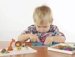 Boy sculpts from plasticine Stock Footage