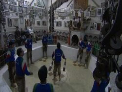 Man juggling surrounded by ring of men, in arena, House of strength, Esfahan, Iran (sound available) Stock Footage