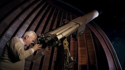 Old man in observatory Stock Footage