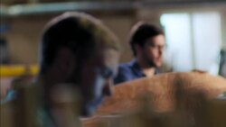 Young craftsmen work on various projects in modern wood shop Stock Footage