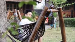 young man taking a selfie in the garden by smart phone Stock Footage