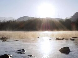 MS T/L View of Sunrise of Soyang River(Famous tourist attraction in Korea) covered with fog / Chuncheon, Gangwondo, South Korea  Stock Footage