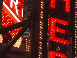 A blinking Broadway style sign outside the Hershey Store in Time Square Stock Footage