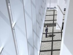  PAN Businesswoman walking into sunny lobby area, answering her cell phone, then walking away / Seattle, Washington, United States Stock Footage