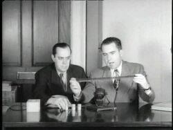 U.S. Representative Richard Nixon and Robert Stripling of the House of Un-American Activities Committee  examine the Pumpkin Papers which was microfilm hidden inside a pumpkin by Communist spy Whittaker Chambers. Stock Footage