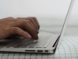 Typing on a Notebook - Dolly Shot Stock Footage