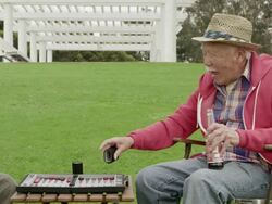 MS PAN Shot of two senior men playing backgammon / Venice, California, United States Stock Footage