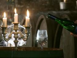MS Romantic scene in barrel cellar and glass filling by wine / Ayl, Rhineland-Palatinate, Germany Stock Footage