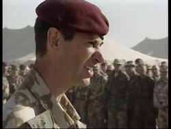 WRAP  Aerials of troops in desert, tank movements. commander's final address News Clip