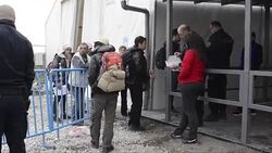 CLEAN : Refugees arrive at registration camp in Macedonia News Clip