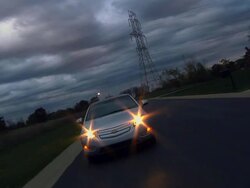 WS POV Electric car driving past high voltage power lines and into suburb / Rochester, Michigan, United States Stock Footage
