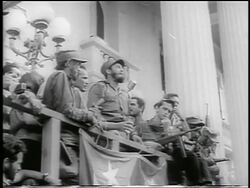 B/W 1959 low angle Fidel Castro making speech from balcony / post-revolution Havana / newsreel Stock Footage