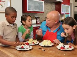 MS ZI Chef and children (6-11) eating cake / Los Angeles, California, USA Stock Footage