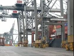 Crane vehicle moving across docks, Container Terminal, Southampton, UK Stock Footage