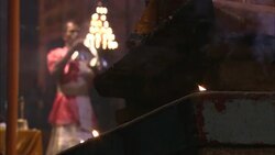 Hindu monks use burning torches for puja during India's Diwali festival. Stock Footage