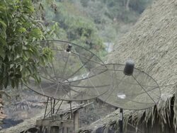 WS satellite antennas in a remote village / Xam Neua, Laos Stock Footage