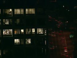 Aerial CU at night of lights in skyscraper windows of apartment / Beverly Hills, California, United States. Stock Footage