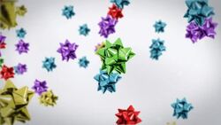 Colorful gift bows float against a white background. Stock Footage