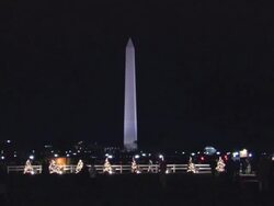 WS Washington Monument illuminated at dark during the holiday season / Washington, D.C., United States Stock Footage