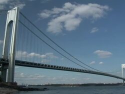 Time lapse of clouds, boats, waves and traffic moving quickly around the verrazano-narrows bridge during the day  Stock Footage