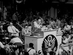 1948: DEMOCRATIC NATIONAL CONVENTION: Unidentified male behind podium continues reading Committee recommendations: ...responsible for Civil Rights gains, commits to eradicating discrimination, Right to live work vote as guaranteed by Constitution... Instructional Video