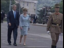 Bush lays wreath at eternal flame monument News Clip