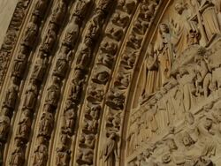 CU TU sculptures in front gate of Notre Dame de Paris Cathedral / Paris, Paris, France  Stock Footage
