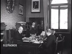 1940s: VATICAN CITY: GOVERNOR: Men in suits walking up/down hall. Governor (1929-1952) Marchese Camillo Serafini (1852-1952) sitting at desk in office, going over paperwork w/ others. Talking on telephone (No SOT).   [Note: Position no longer exists] Instructional Video