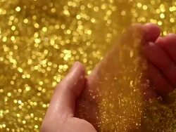 gold sand drop in hand bowl Stock Footage