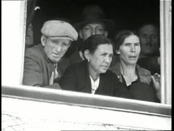 Immigrants view Ellis Island from the deck of a ship. News Clip