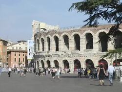 MS Shot of Tourists roaming in front of Arena di Verona at Piazza Bra / Verona, Veneto, Italy Stock Footage