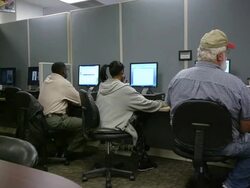 MS PAN Job seekers studing computer screens at state run job center / Jackson, Michigan, United States  Stock Footage