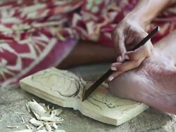 CU R/F Shot of man carving piece of wood into mask / Ubud, Bali, Indonesia Stock Footage