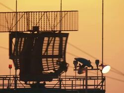 Long Shot static - A radar antenna spins at an airport Stock Footage