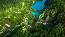 AERIAL: Plitvice Lakes with waterfalls and surrounding forest Stock Footage