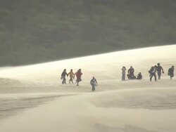 MS AERIAL Shot of people crowd at Dune du Pilat / Aquitaine, France Stock Footage