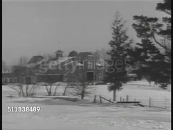 1941: NEW YORK: PAN Rural Scandinavian owned upstate New York dairy farm. MS Dairy cattle in barn. Swedish-Americans enjoying after dinner coffee at table. Instructional Video