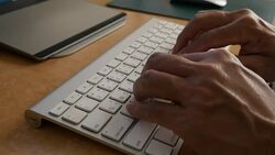 Man hands typing computer keyboard Stock Footage