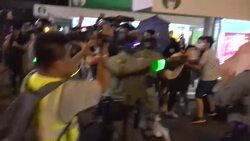 Scuffle breaks out between police and protesters News Clip