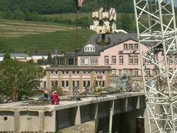 WS Workers working at deconstruction of bridge over river Mosel with crane hook moving / Wellen, Rhineland Palatinate, Germany Stock Footage