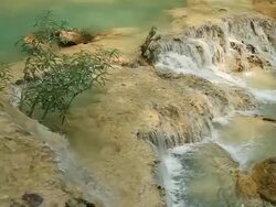 MS SLO MO Shot of small waterfall / Kuang Si, Luang Prabang, Laos Stock Footage