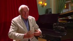 Legendary opera director Ioan Holender judges singing competition, reflects on career, communism News Clip